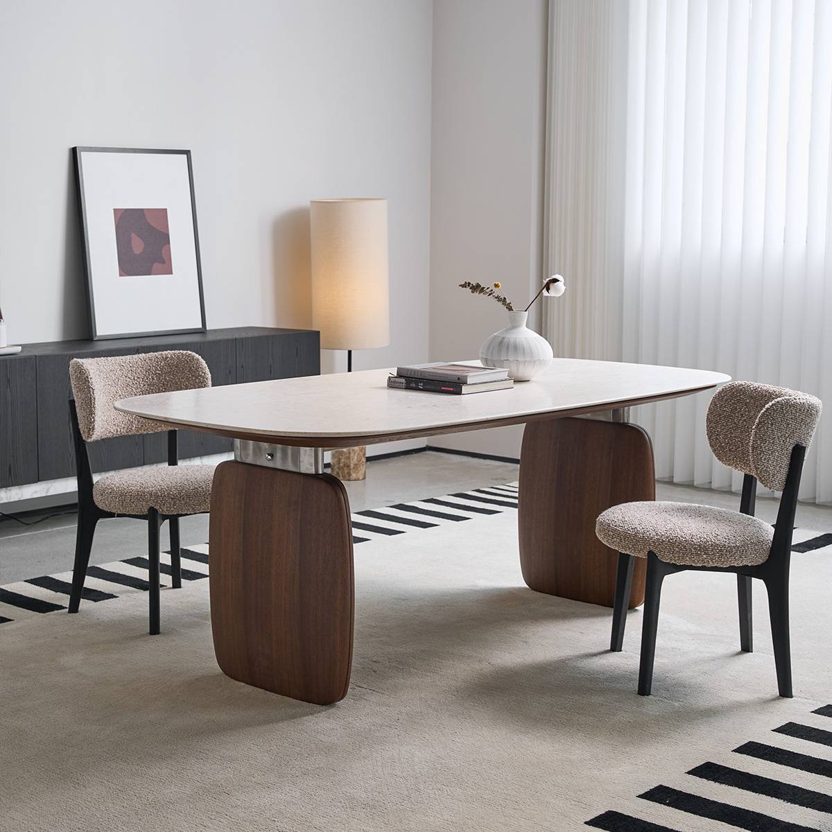 Side angle view of the dining table showing the wood legs and stone top