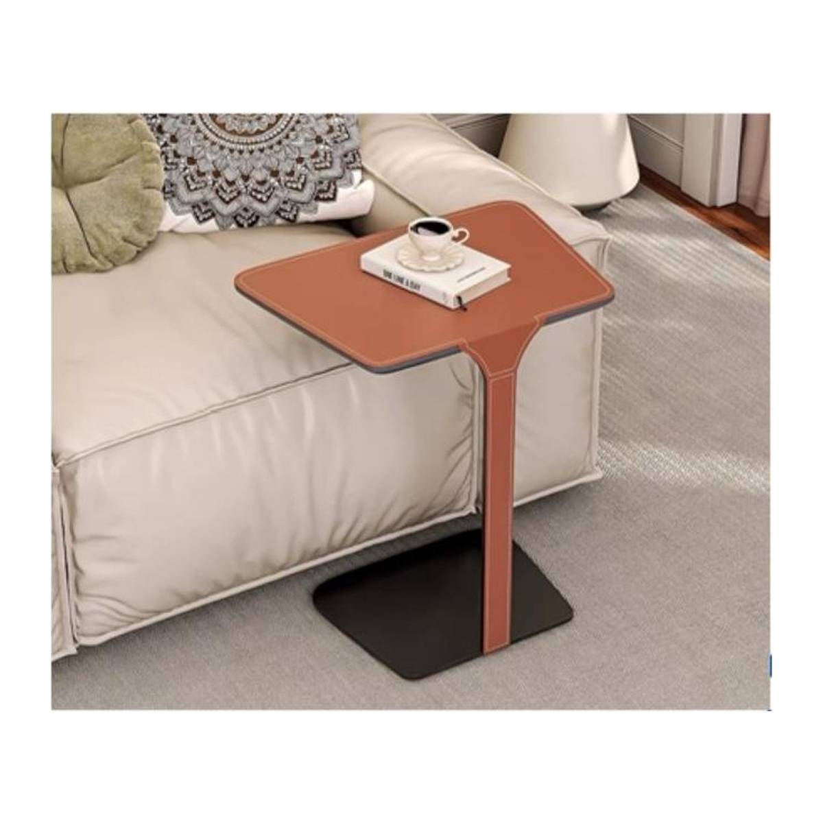 Orange saddle leather side table next to a white sofa