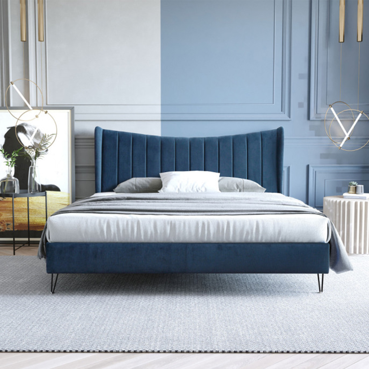 Bedroom setting with the blue velvet bed, grey bedding, and modern decor