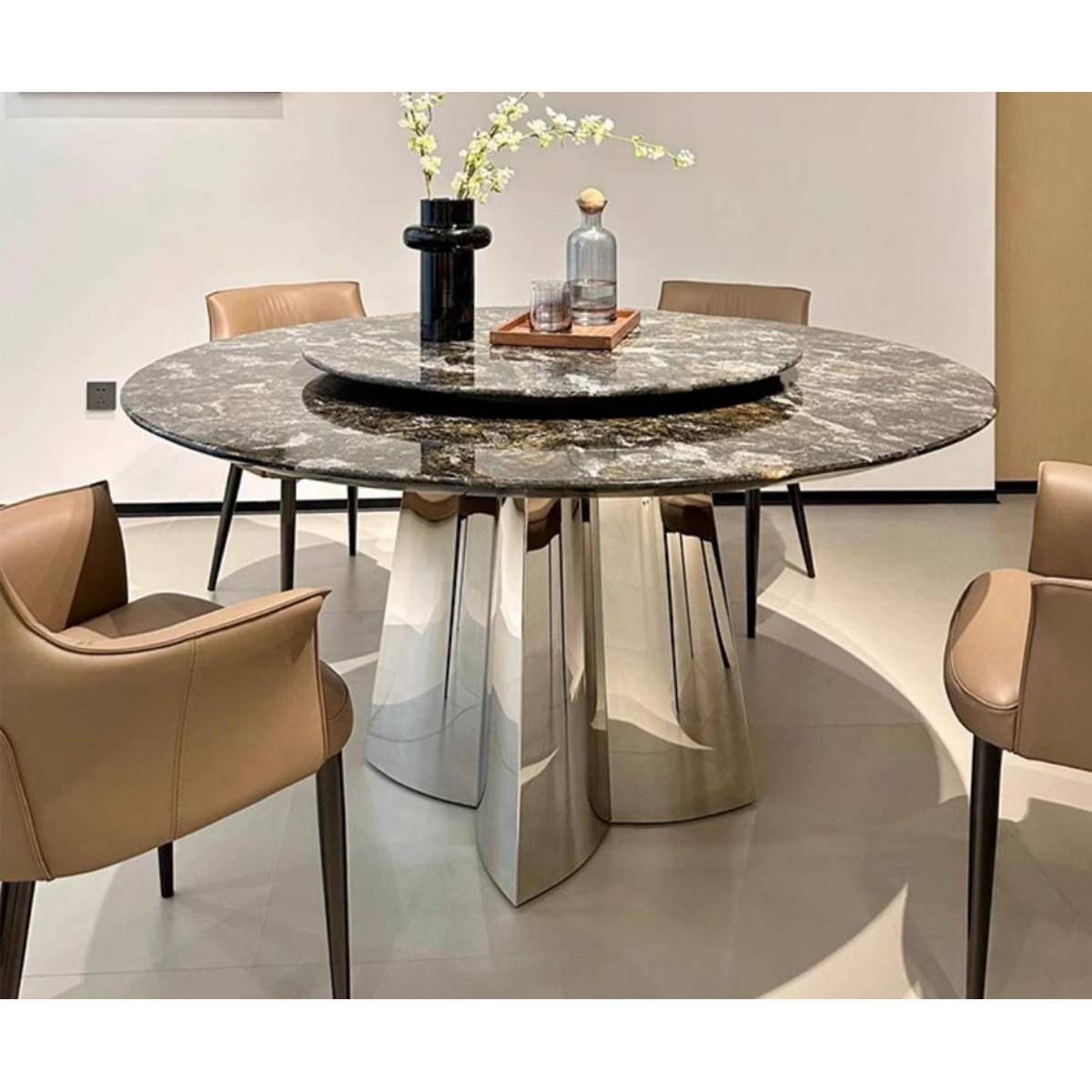 Full view of the dining table set with chairs, displaying the reflective stainless steel base and marble top.