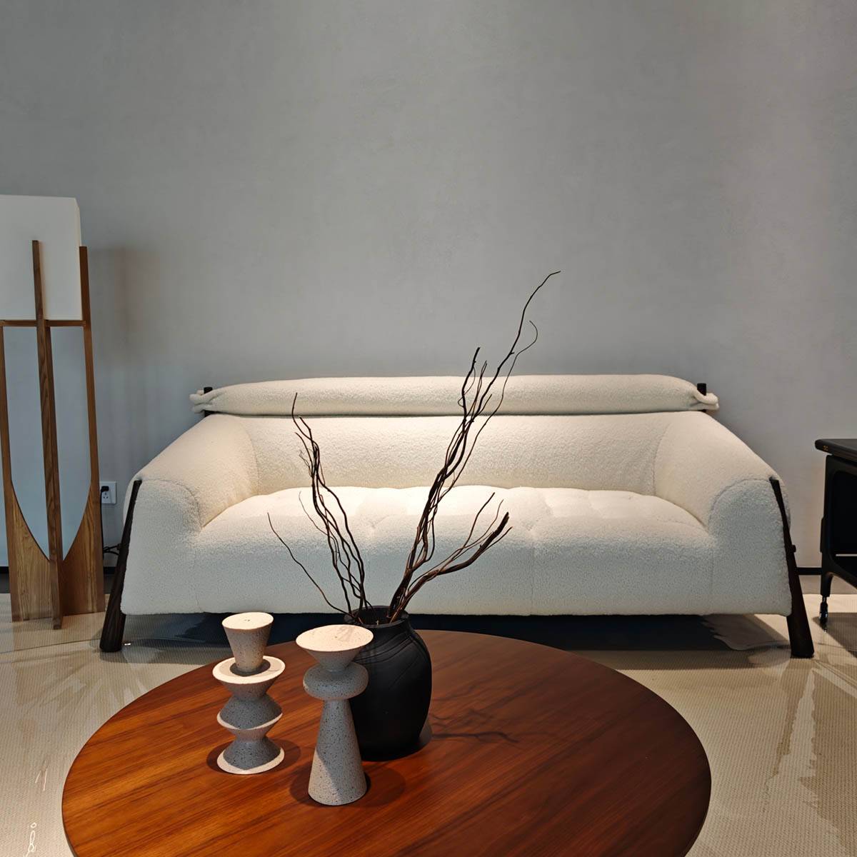 Front view of the white textured fabric sofa with wooden legs