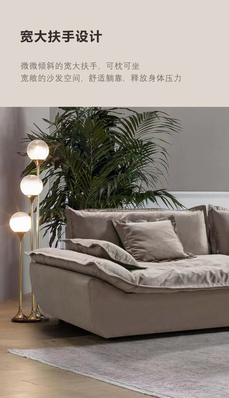 Side view of the sofa highlighting the wide, tilted armrest design.