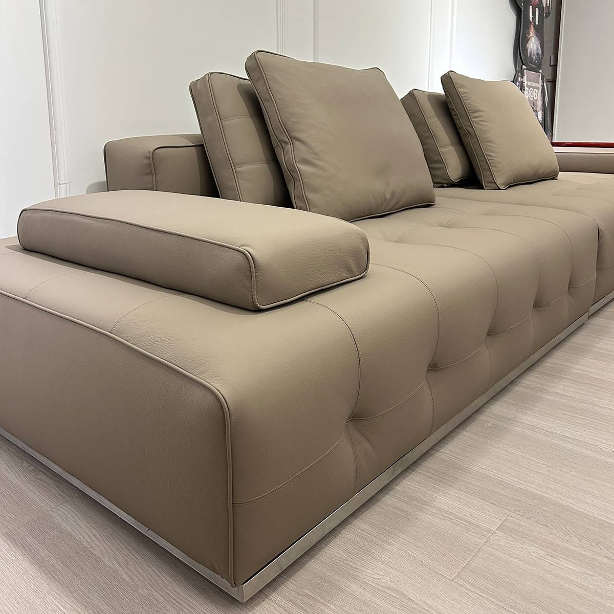 Close-up view of the sofa armrest and back cushions