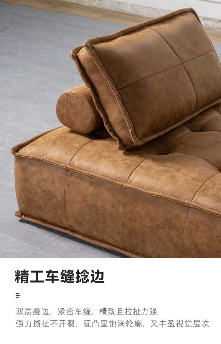 Close-up of the double-layer stitching and edge piping on the sofa base.