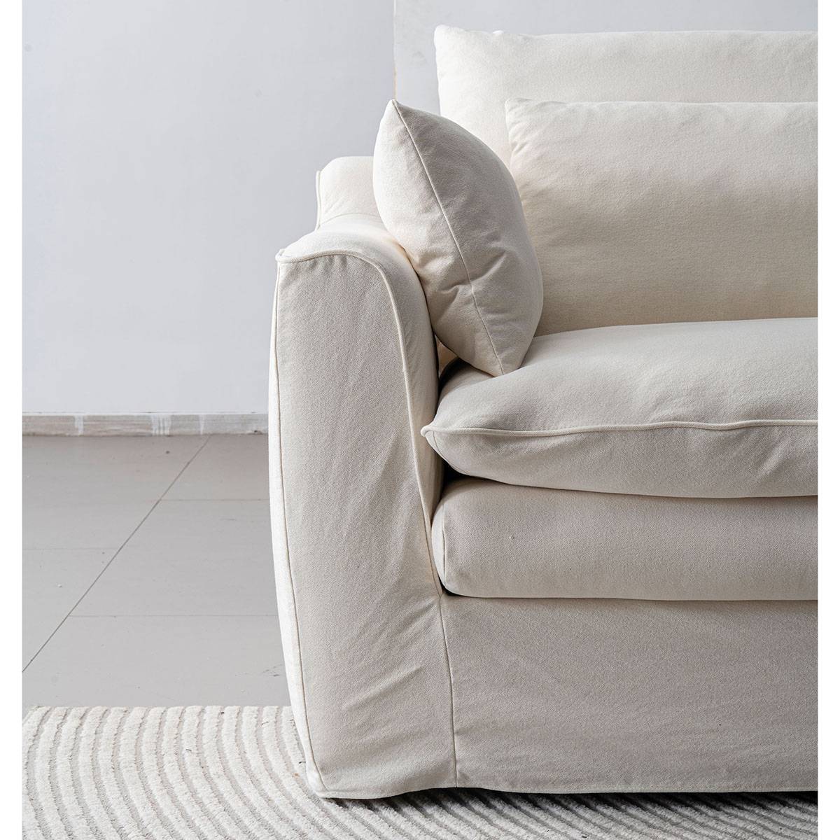 Close-up detail of the sofa armrest and cushion texture