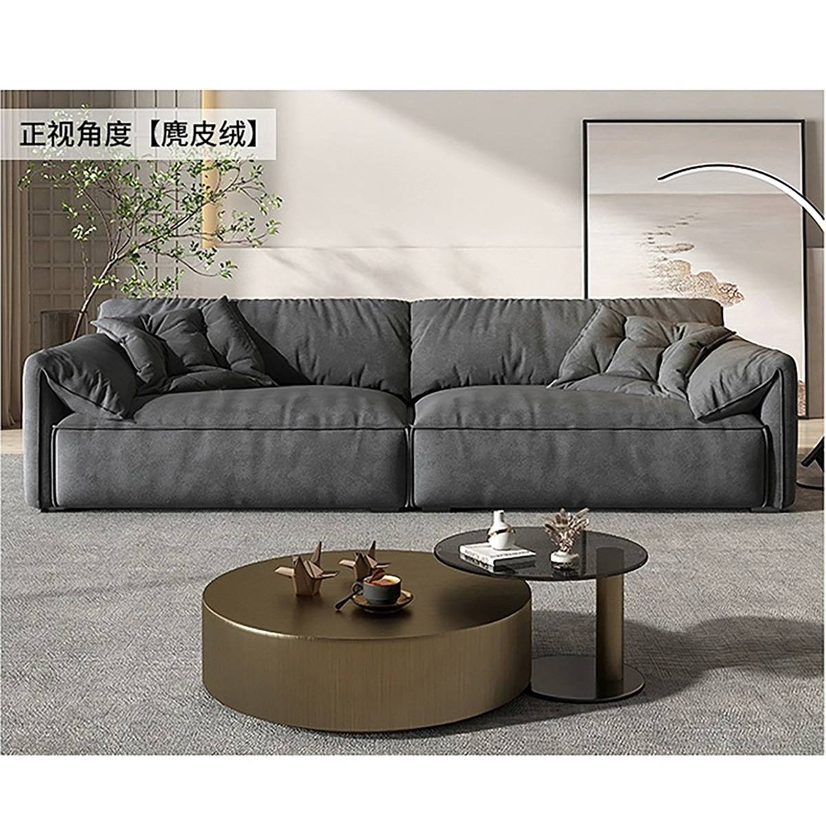 Front view of a grey Elephant Ear sofa with suede-like texture in a modern living room setting.