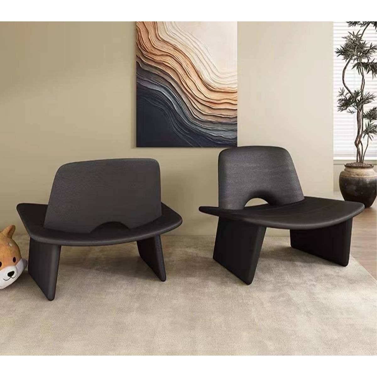 Side profile view of the black lounge chair showing the backrest cutout
