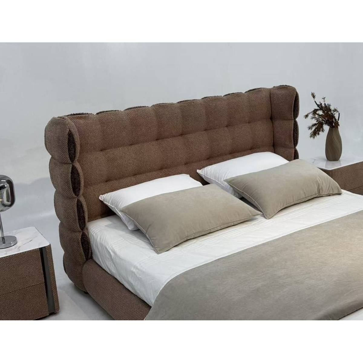 Close-up angled view of the bed headboard and pillows