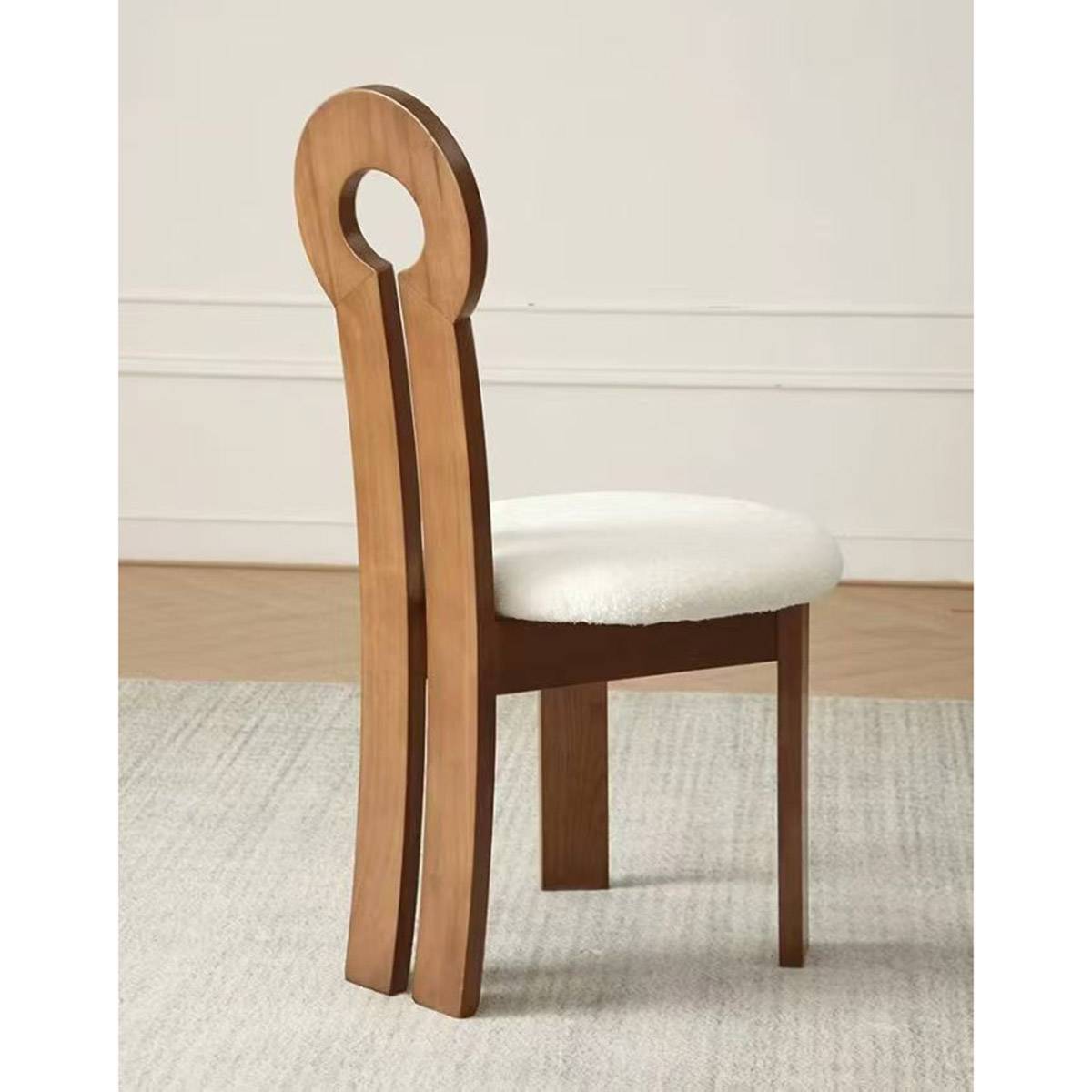 Dining chair with black frame and grey faux leather seat