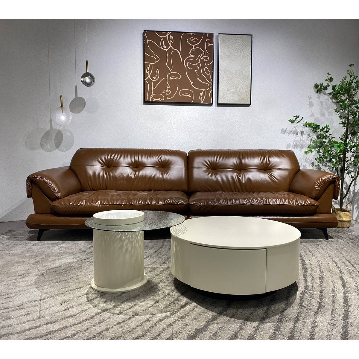 Front view of brown leather sofa with coffee tables