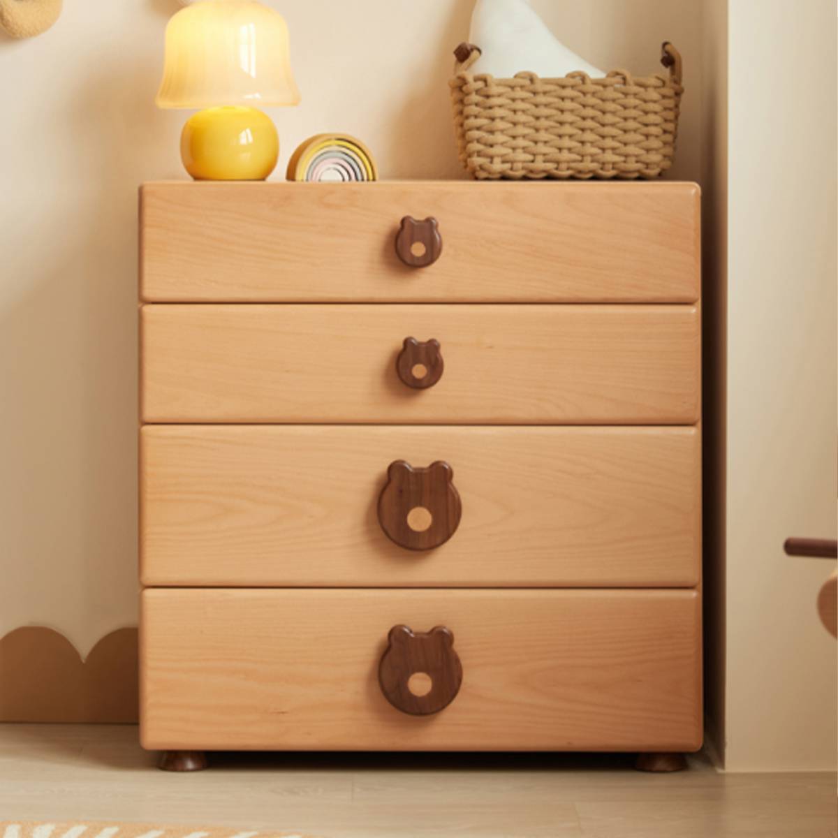 Front view of the chest of drawers with lamp and basket on top