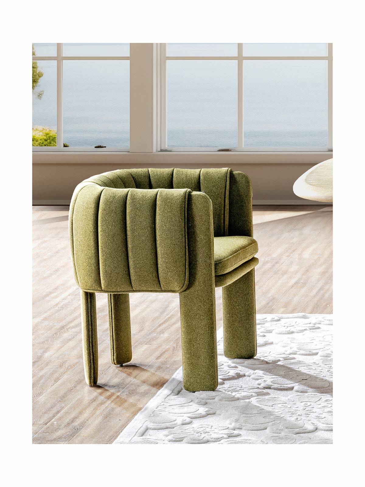 Side view of the green lounge chair in a room setting
