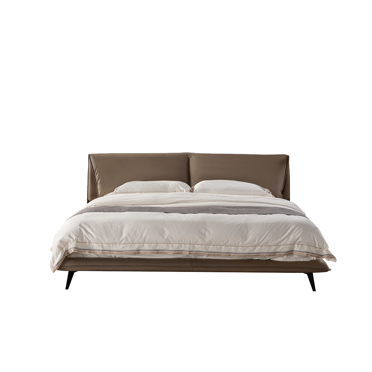 Front view of the bed showing the headboard and bedding