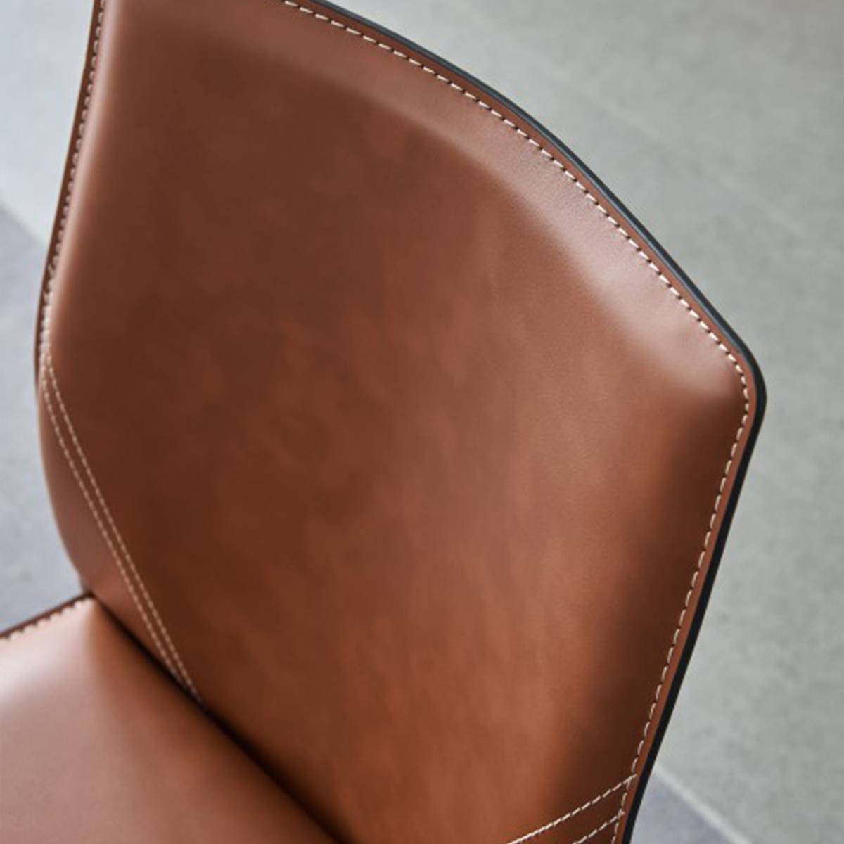 Detail shot of the top edge of the chair backrest
