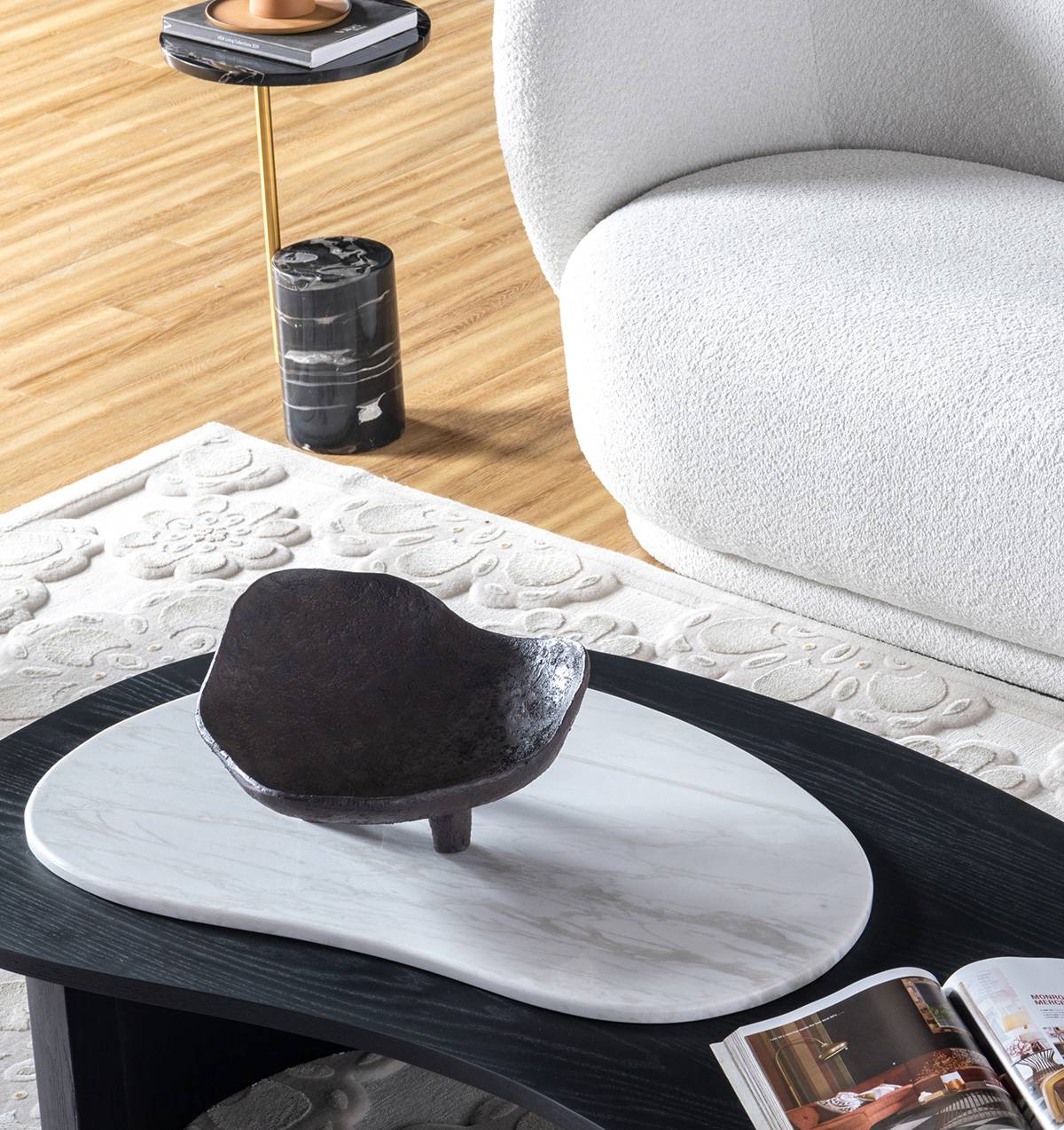 High-angle view of the coffee table showing the curved shape and wood grain texture.