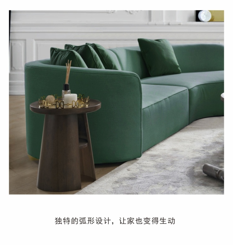 Green curved sofa in a living room setting with side table