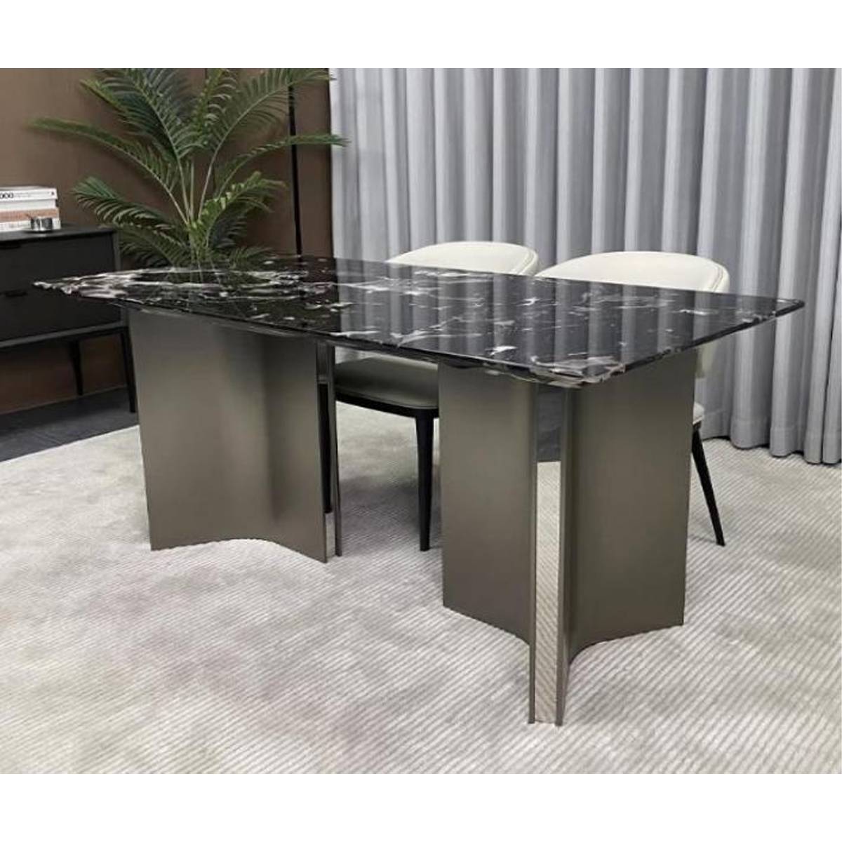 Side view of the dining table showing the stainless steel Mercedes base