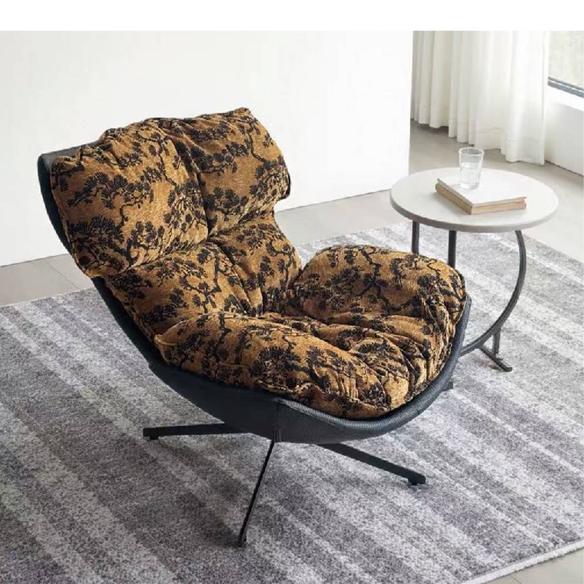 Lounge chair placed on a rug next to a side table