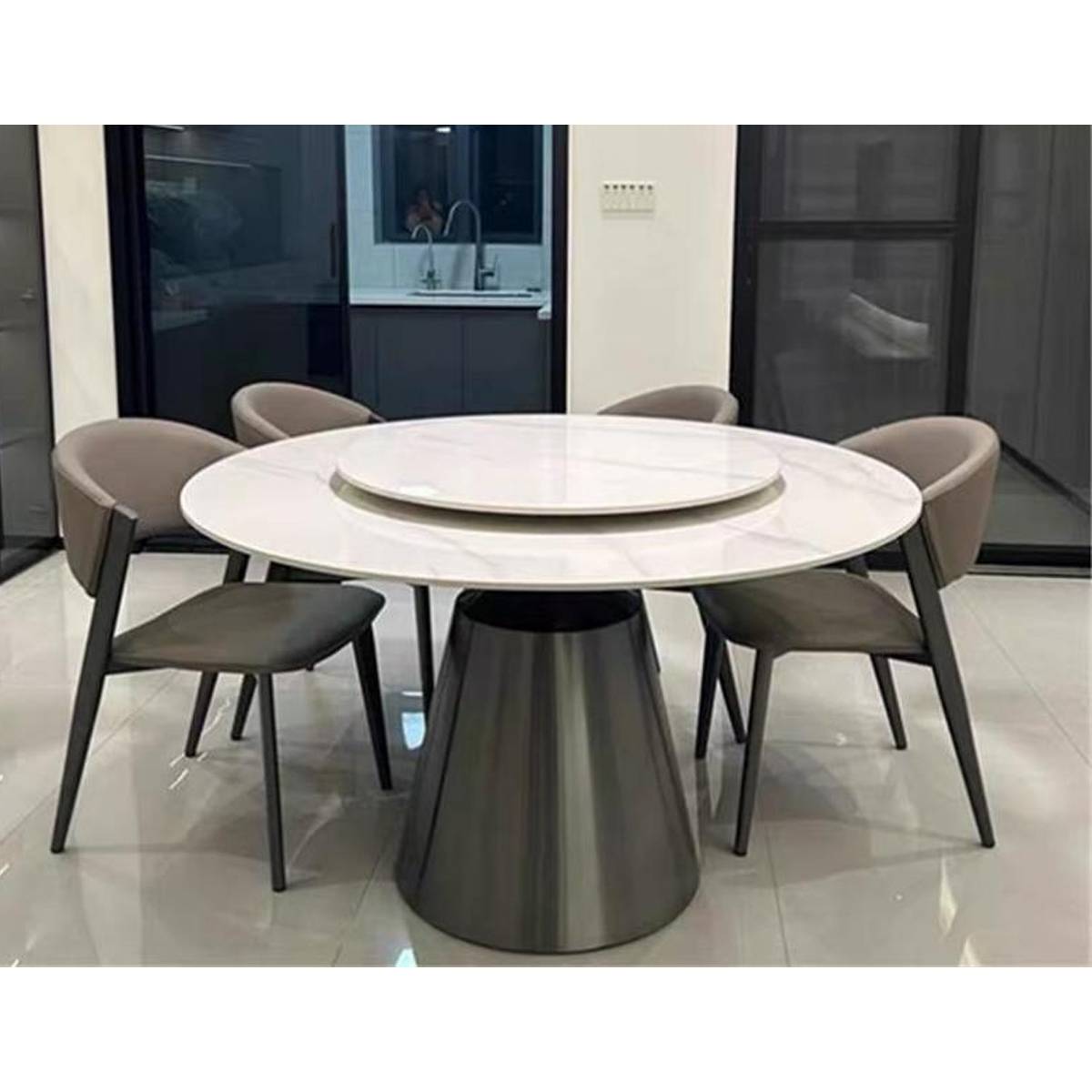 Round dining table with white marble-pattern sintered stone top and grey base
