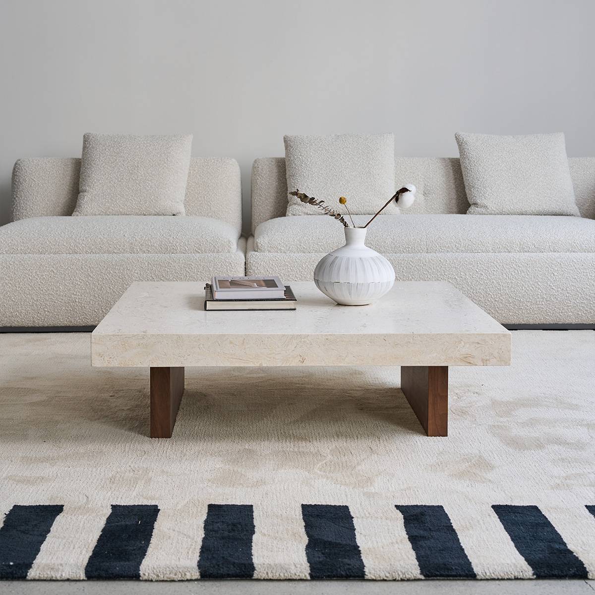 Front view of the coffee table with sofa in background