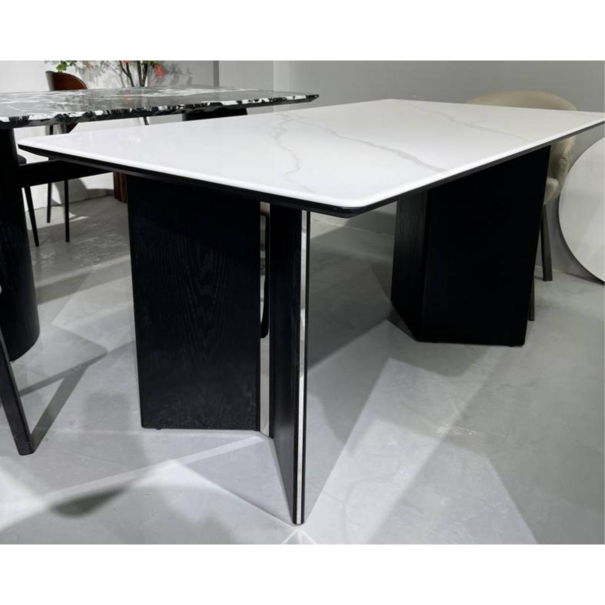 Close-up view of the dining table base and tabletop edge