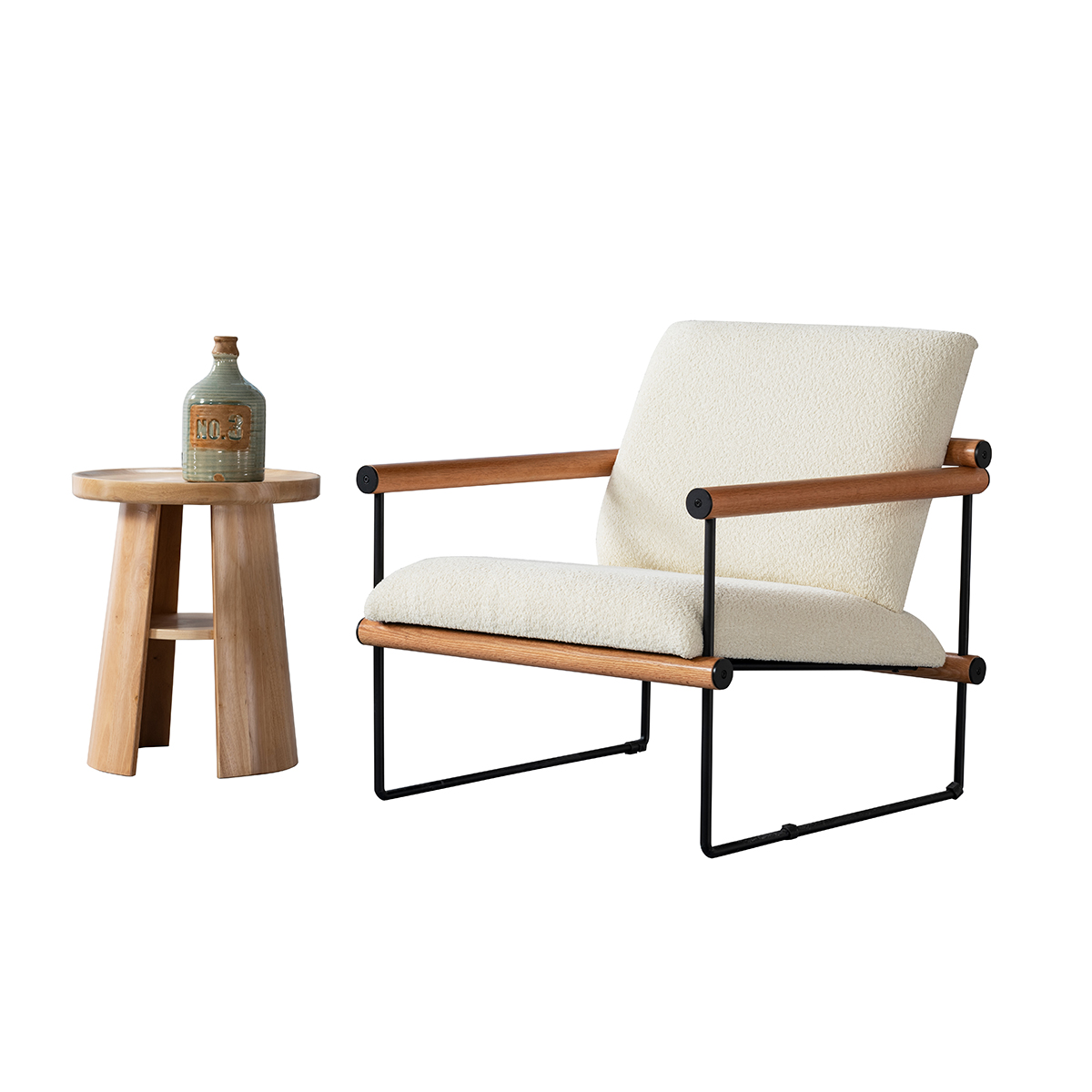 Lifestyle shot of the lounge chair next to a wooden side table with a vase