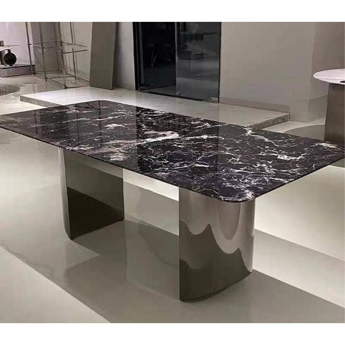 Close up view of the stainless steel D-shape base and marble top