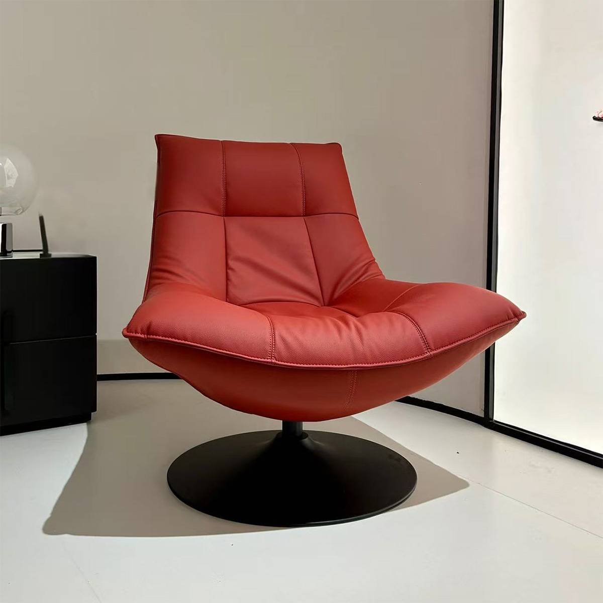 Front view of the red lounge chair showing the seat and backrest details