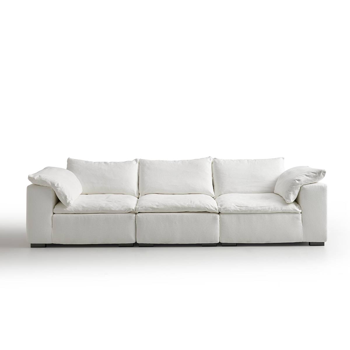 Front view of the white 4-seater sofa highlighting the back pillows and seat cushions