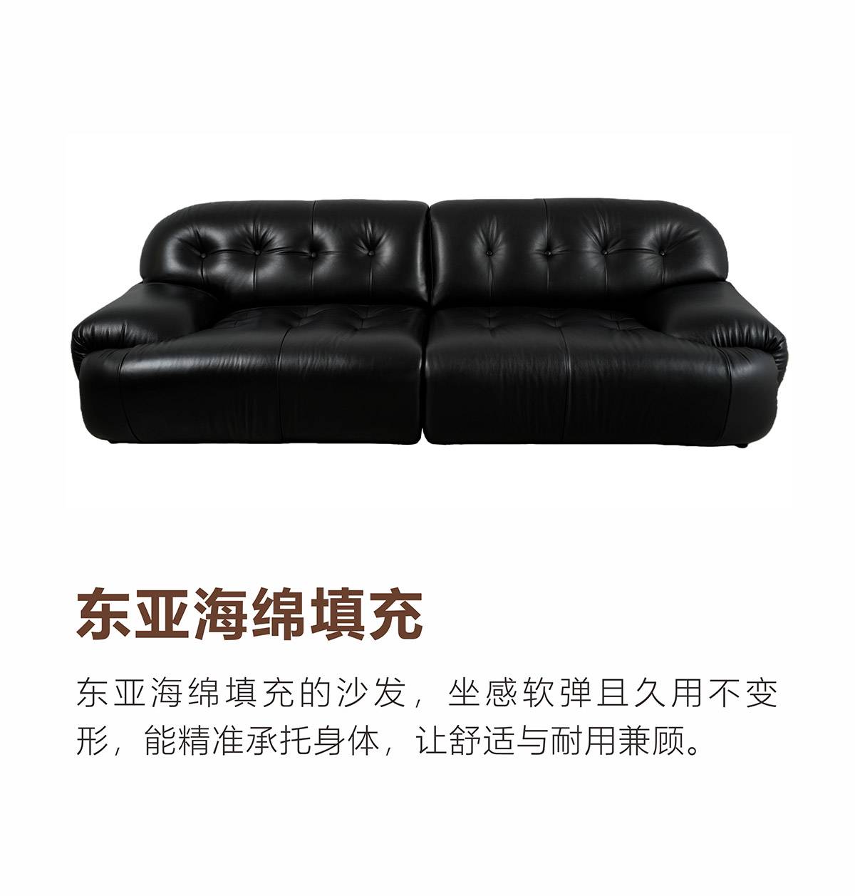 Full view of the black leather sofa showing the tufted back and seat cushions.