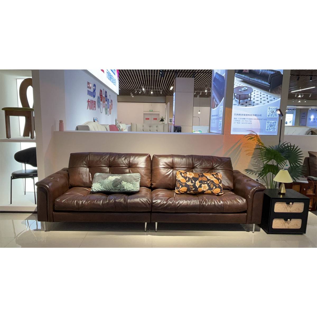 Front view of the brown leather sofa in a showroom setting