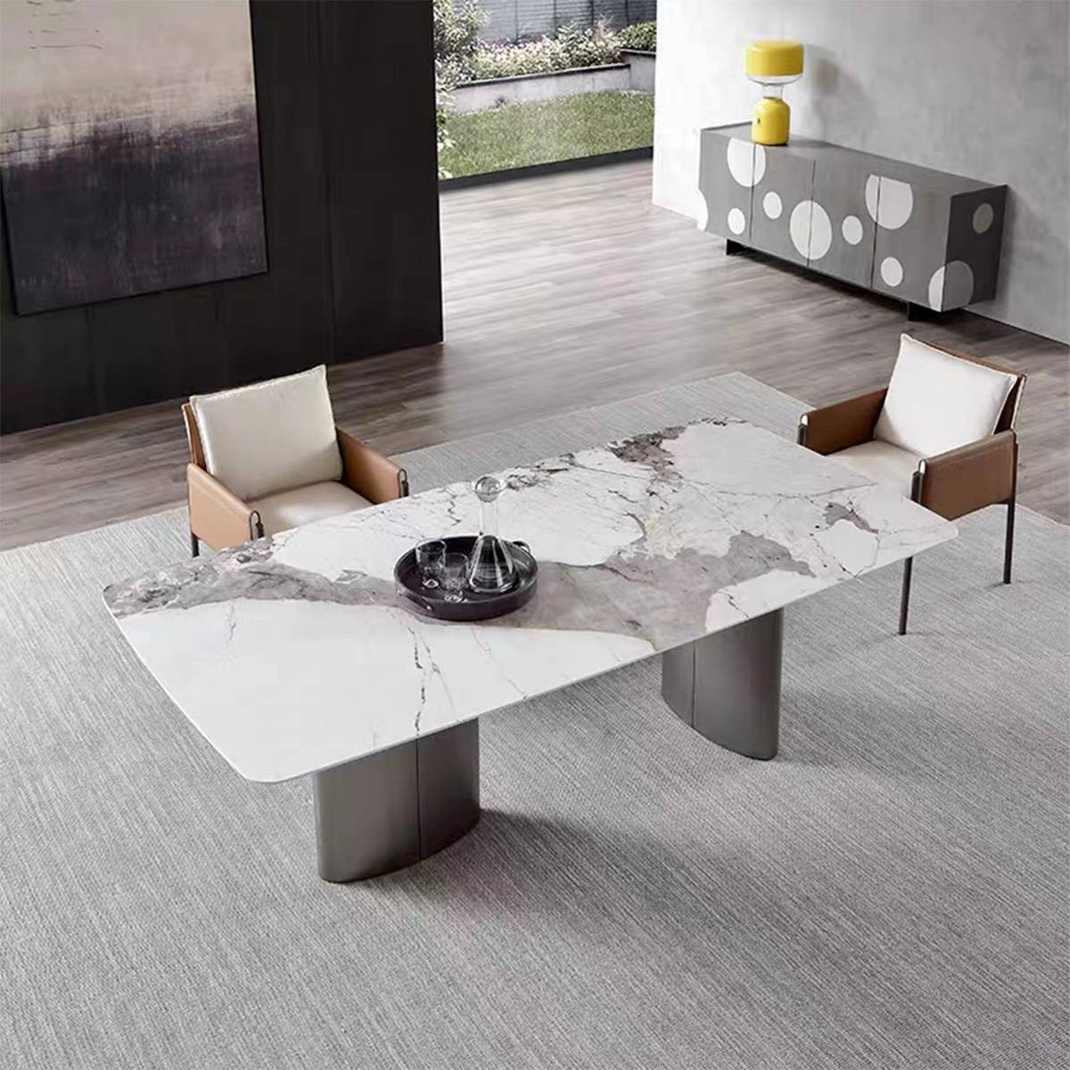 Dining table with white and grey marble pattern top in a living room setting