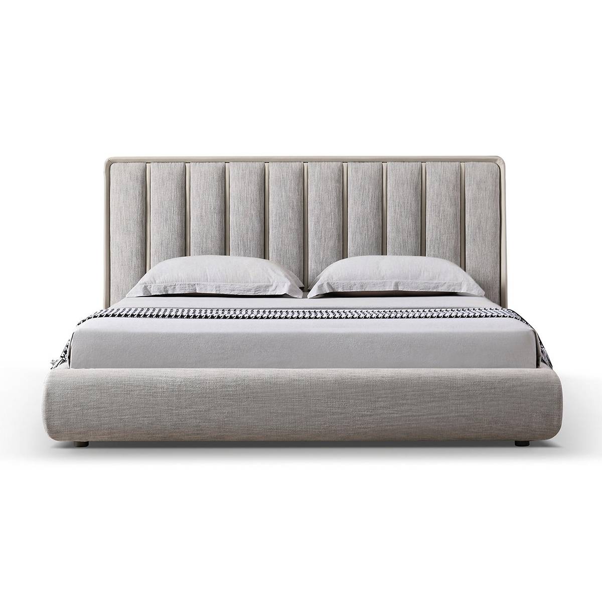 Front view of a grey fabric upholstered bed with a tufted headboard