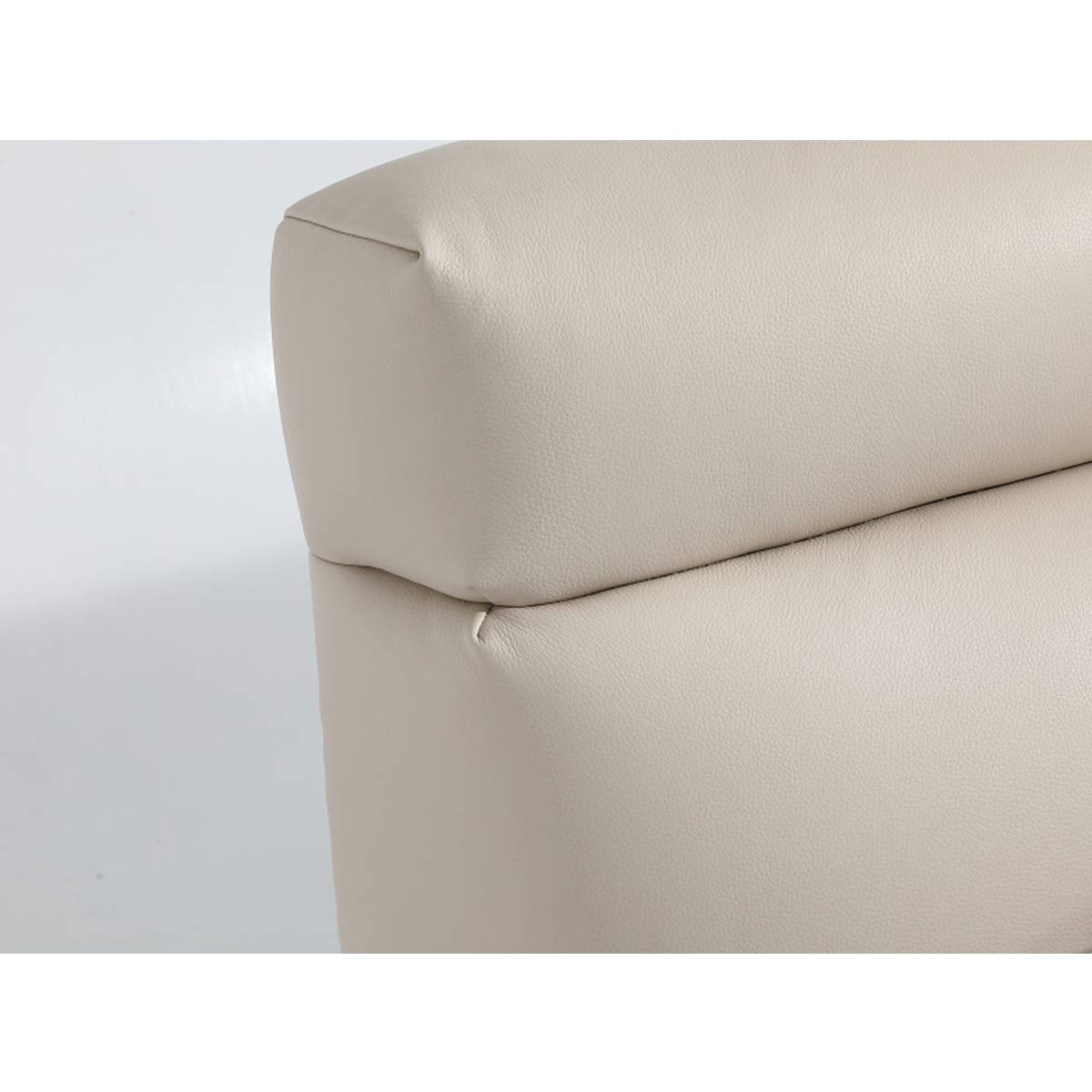 Side view of the upholstered bed frame corner showing the leather finish