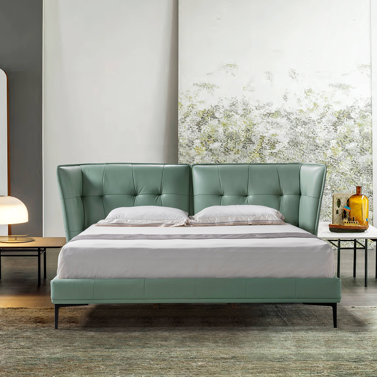 Bedroom setting showing the green bed with bedside tables and decor