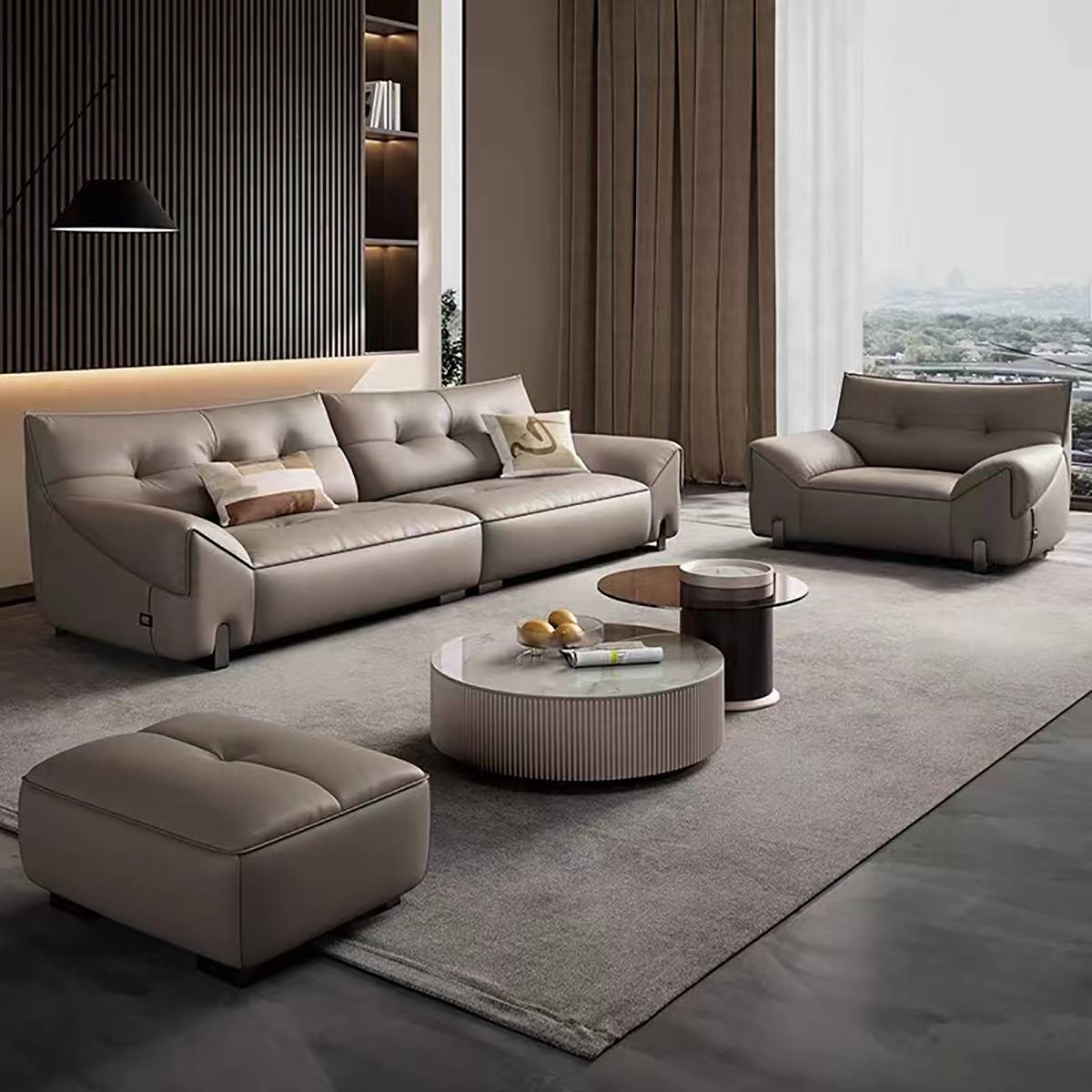 Wide angle view of the sofa set including a matching armchair and ottoman
