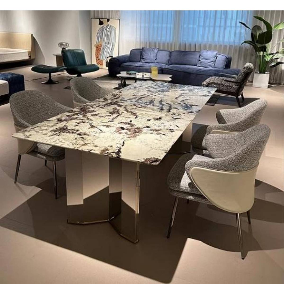Front view of the Snow Mountain Flying Fox marble dining table showing the stainless steel Mitsubishi base