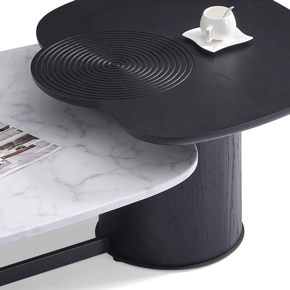 Close-up of the black wood side table with concentric circle texture and marble edge