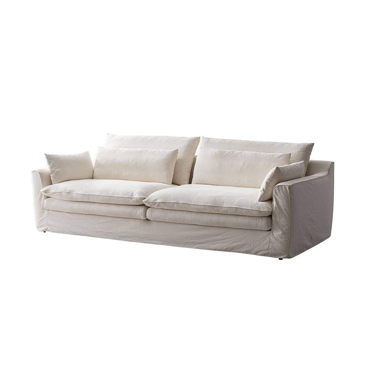 Three-quarter view of the white fabric sofa against a white background