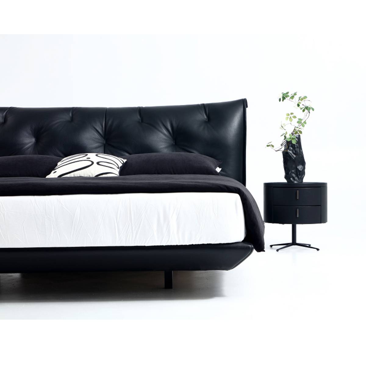 Close-up detail of the bed frame and bedside table