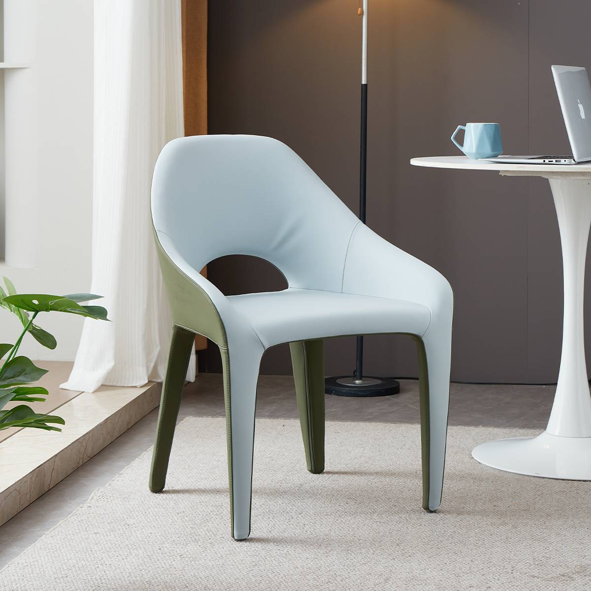 Side view of a light blue and green modern lounge chair