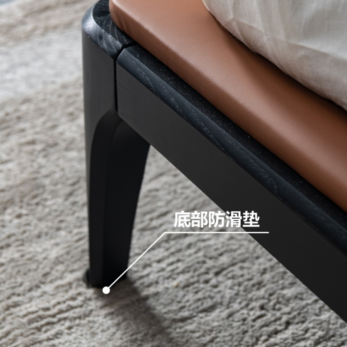 Detail shot of the bed leg base highlighting the anti-slip pad