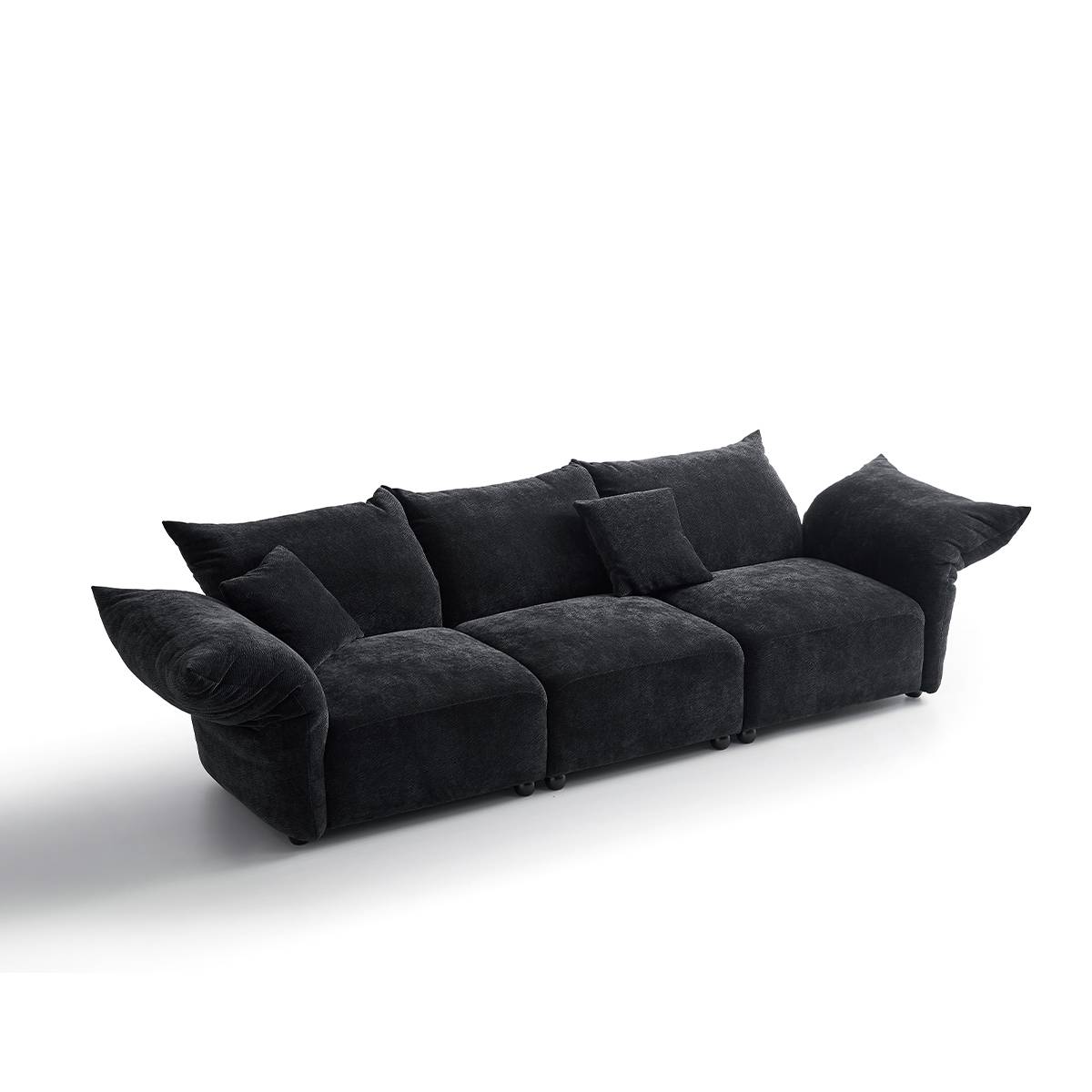 Full view of the black petal sofa showing the modular configuration with left arm, middle section, and corner piece.