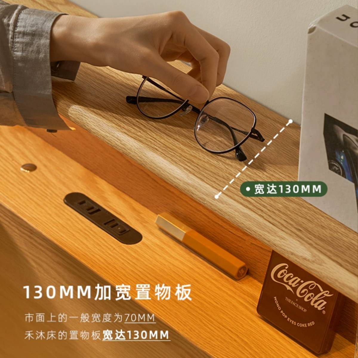 Close-up of the 130mm wide headboard shelf holding glasses and a box, highlighting the storage capacity.
