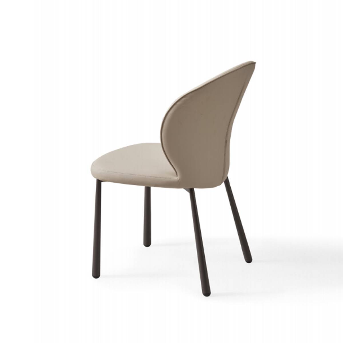 Side view of the beige dining chair showing the curved backrest and tapered legs