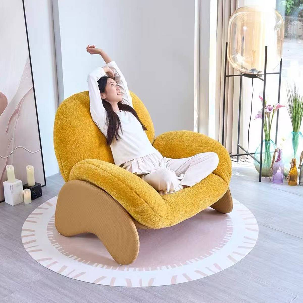 Woman relaxing in yellow lounge chair
