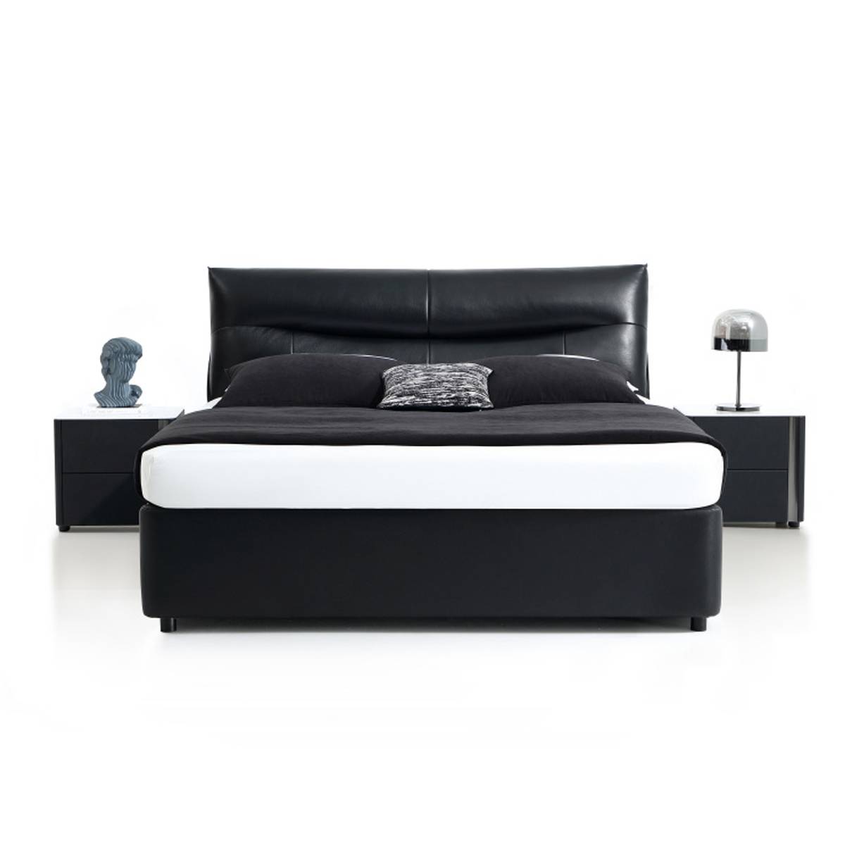Front view of the black leather bed showing the padded headboard and footboard.