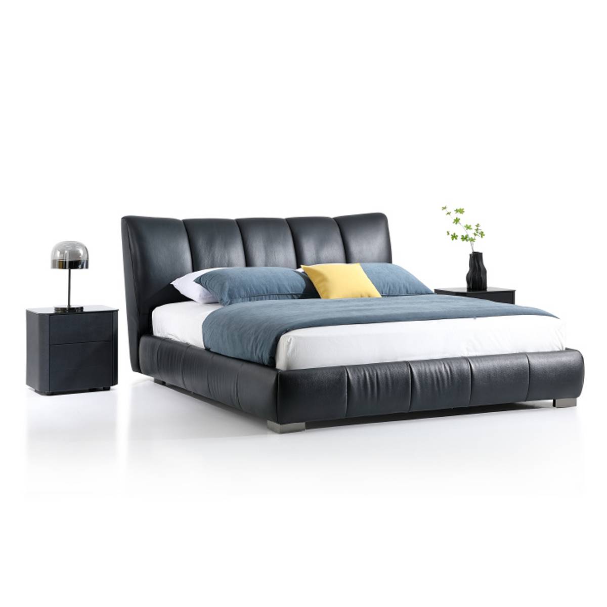 Side angle view of black leather tufted bed