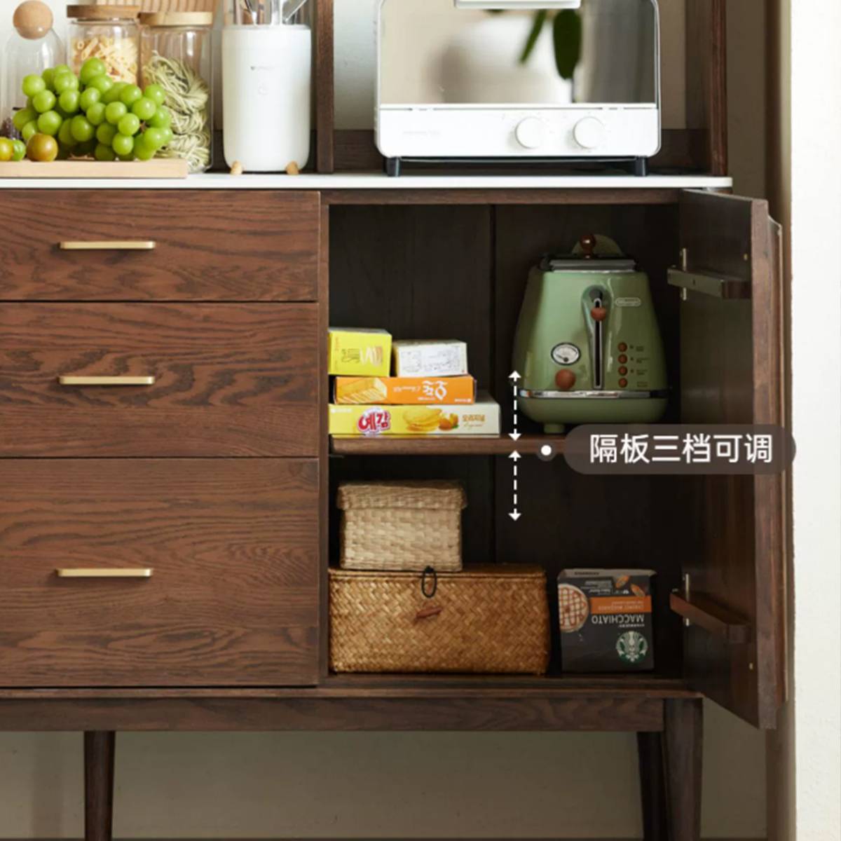 Close-up of the sideboard cabinet interior showing adjustable shelves and storage for a toaster and boxes.