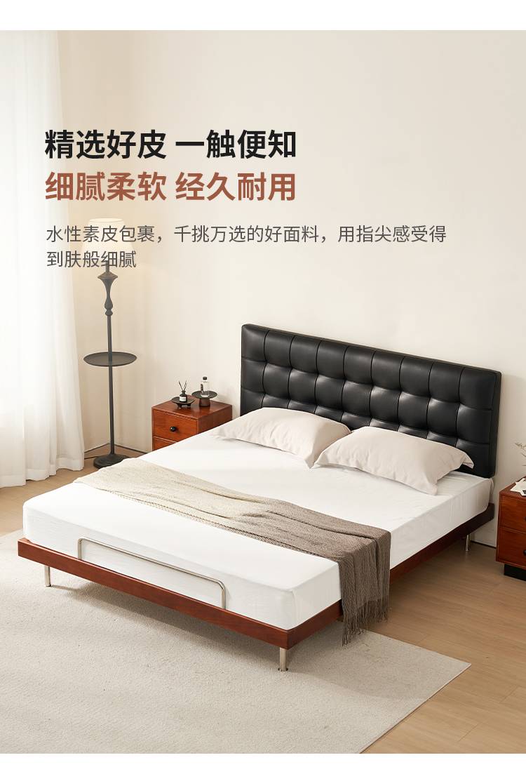 Full view of the bed highlighting the black leather waffle-tufted headboard and walnut frame.